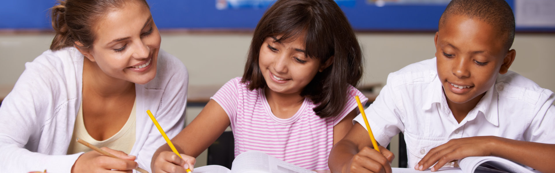 Teacher Assists Students